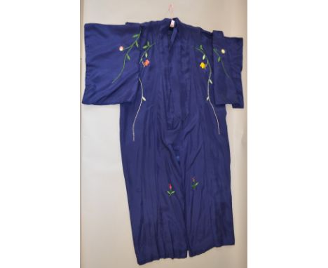 A vintage asian silk Kimono. The gown is lined and beautifully embroidered on the outside with flowers and birds. 140cm long.