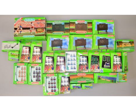 Subbuteo 13 boxed 80s/90s teams, together with a good quantity of boxed accessories including Grandstand and Scoreboards.