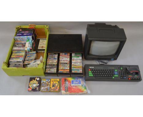 An Amstrad CPC 464 console with quantity of games and Amstrad monitor