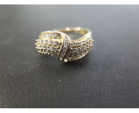 A 9ct gold brilliant-cut diamond four row crossover style ring - Hallmarked Birmingham - Ring size S - Weight approx 4.2gms
C