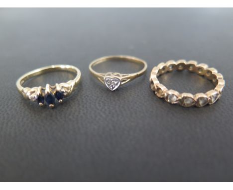 Two 9ct gold gem-set dress rings - To include sapphire and diamond - A heart-shape dress ring with diamond highlight - Both s