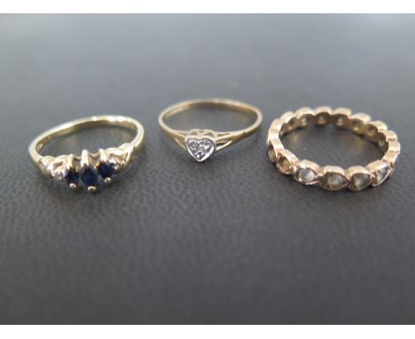 Two 9ct gold gem-set dress rings - To include sapphire and diamond - A heart-shape dress ring with diamond highlight - Both s