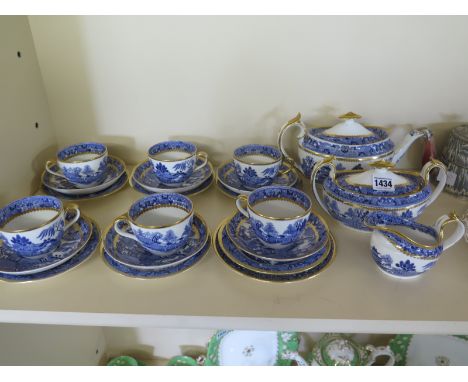 A Davenport six setting blue and white tea service bridge pattern 3588 with extra plate - stapled repairs to teapot, one cup 