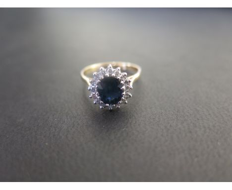 An 18ct gold sapphire and diamond cluster ring - Hallmarked Birmingham - Ring size K 1/2 - Weight approx 2.8gms
Condition Rep