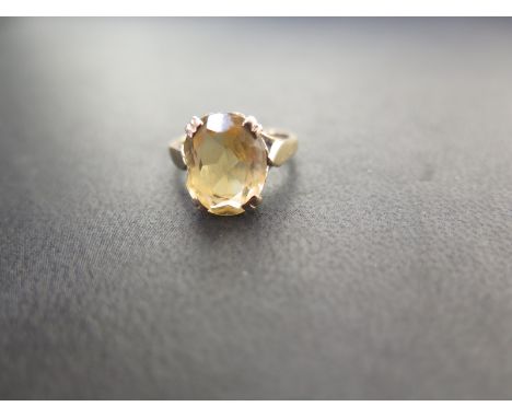 A 9ct gold citrine single-stone ring - Hallmarked London - Ring size I 1/2 - Weight approx 2.6gms
Condition Report: Good - Wi