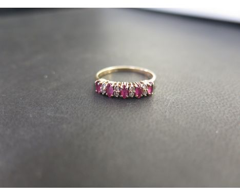 A 9ct gold ruby and diamond half-circle ring - Hallmarked London - Ring size K 1/2 - Weight approx 1.9gms.
Condition Report: 