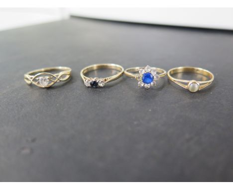 Four gem-set rings - To include sapphire, cats eye cabochon, cubic zirconia - All test as 9ct gold - Ring sizes K, N and P - 