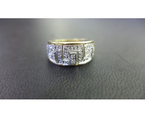 A 9ct gold diamond band ring - Of Greek Key design - Hallmarked Birmingham - Ring size Q 1/2 - Weight approx 3.4gms
Condition