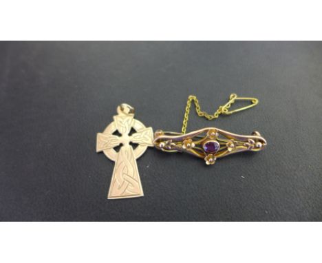 A cross pendant, length 4cms - Together with an amethyst bar brooch, width 3.5cms - Both with marks indicating 9ct gold - Tot