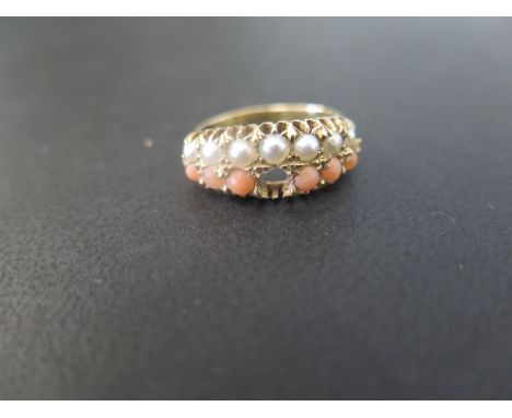 An 18ct gold seed pearl and coral dress ring - Hallmarked Chester, 1906 - Ring size N - Weight approx 5.0gms
Condition Report