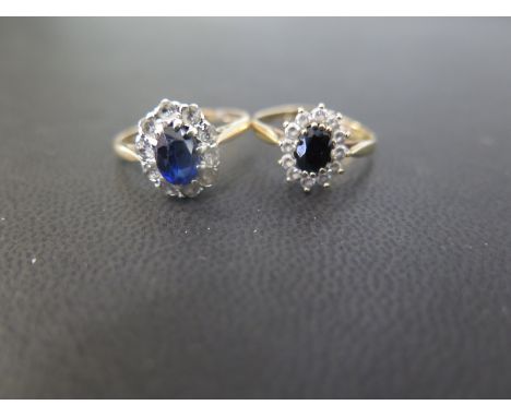 Two sapphire and white-gem cluster rings - Both with marks indicating 9ct gold - Ring sizes K 1/2 and L 1/2 - Weight approx 4