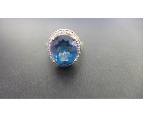 A 9ct gold topaz and diamond ring - Hallmarked Birmingham - Ring size N - Weight approx 4.6gms
Condition Report: Good - With 