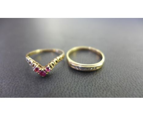 A 9ct gold diamond band ring - Size L - Together with a 9ct gold ruby chevron-shape ring - Size J - Both hallmarked London - 