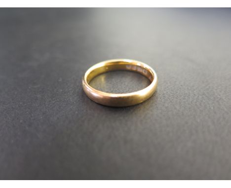 A 22ct gold band ring - Hallmarked Birmingham - Ring size N - Weight approx 4.4gms
Condition Report: Good - With light surfac