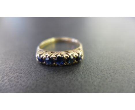 A 9ct gold sapphire five-stone ring - Hallmarked Edinburgh - Ring size N 1/2 - Weight approx 2.0gms
Condition Report: Good - 