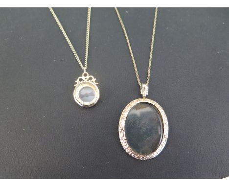 A 9ct gold photo pendant - Hallmarked Chester - Length 5.3cms - Suspended from a 9ct gold fancy-link chain - Hallmarked Birmi