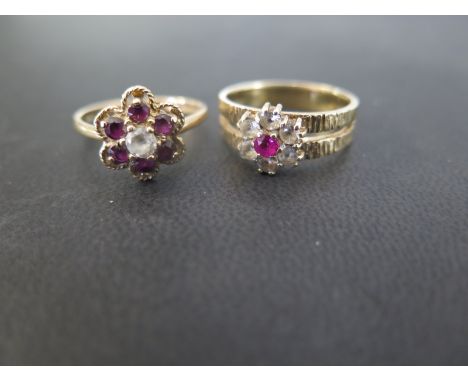 Two 9ct gold cluster rings - To include garnet and white-gem, size P - Together with ruby and white-gem, size Q - Hallmarked 