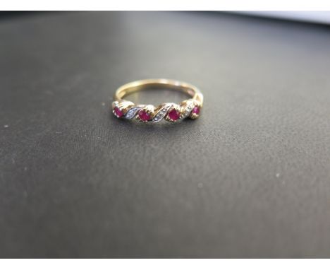 A 9ct gold ruby and diamond twist ring - Hallmarked Sheffield - Ring size P - Weight approx 2.1gms
Condition Report: Good