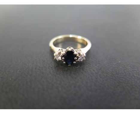 A sapphire and diamond three-stone crossover ring - Stamped 9ct - Ring size H - Weight approx 2.4gms
Condition Report: Good