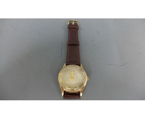 A 9ct gold cased Longines gentleman's wristwatch, the circular silvered dial with arrow head markers and Arabic numerals at 1