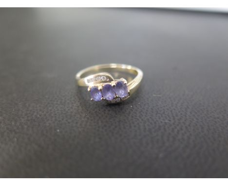 A 9ct gold tanzanite and diamond crossover dress ring - Hallmarked Birmingham - Ring size N - Weight approx 2.3gms
Condition 