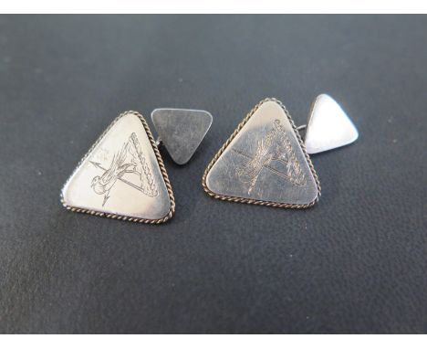 A pair of silver cufflinks - Each of triangular outline with bird crest - Hallmarked London, 1981, makers mark A D - Width 2c