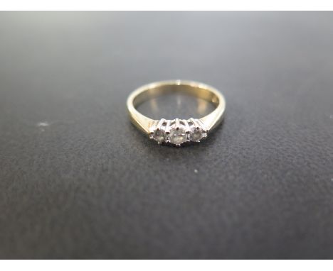 A 9ct gold brilliant-cut diamond three-stone ring - Total diamond weight 0.25ct, stamped to band - Hallmarked Birmingham - Ri