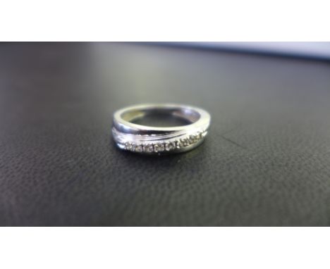 A 9ct gold diamond band ring - Hallmarked London - Ring size M - Weight approx 2.5gms
Condition Report: Good - With light sur