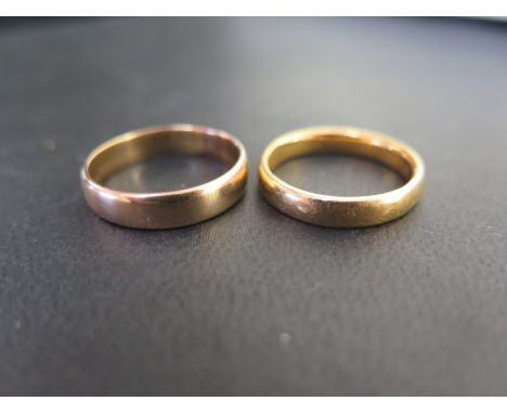 Two 22ct gold band rings - Hallmarked Birmingham - Ring sizes Q and R 1/2 - Total weight approx 11.2gms
Condition Report: Goo