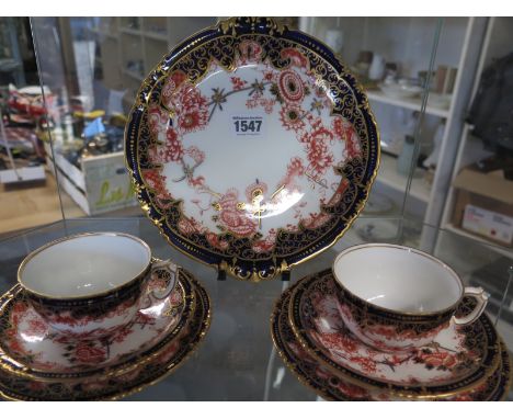 Two sets of Royal Crown Derby cups, saucers and plates together with a cake dish pattern no. 5852, circa 1900 - seven items
C