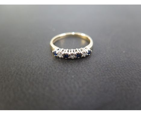 A 9ct gold sapphire and diamond seven-stone ring - Hallmarked Birmingham - Ring size I 1/2 - Weight approx 1.6gms
Condition R