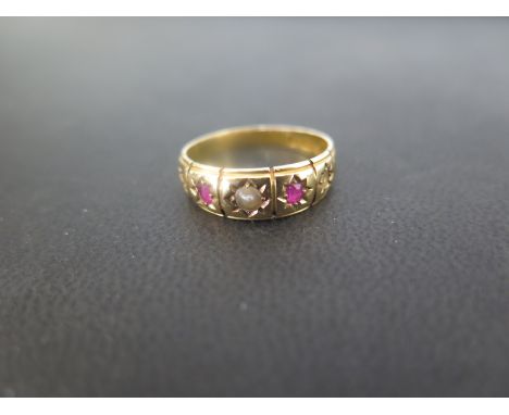 An 18ct gold ruby and seed pearl ring - Hallmarked Birmingham - Ring size N - Weight approx 3.6gms
Condition Report: Fair - W