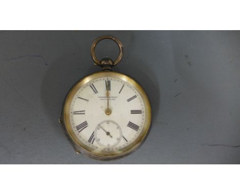 A silver hallmarked open faced pocket watch by Kendal and Dent, Roman numerals to white enamel dial with subsidiary second ha