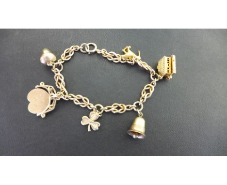 A 9ct gold fancy-link bracelet suspending six charms - Hallmarked Birmingham - Length 19.5cms - Weight approx 22.6gms
Conditi
