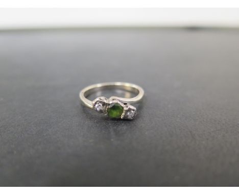 A tourmaline and diamond three-stone crossover ring - Tests as 9ct gold - Ring size M - Weight approx 3.5gms
Condition Report