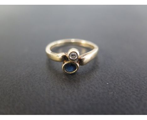 A sapphire and diamond two-stone crossover style ring - Hallmarked London - Ring size N - Weight approx 2.1gms
Condition Repo