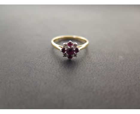 A ruby and diamond cluster ring - Stamped 18ct and plat - Ring size L - Weight approx 2.6gms
Condition Report: Good - With li