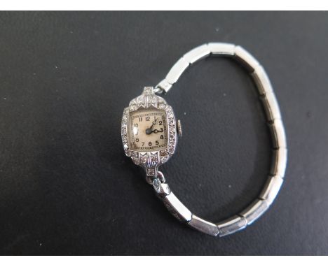 A diamond cocktail watch - The Arabic numerals within a single-cut diamond surround to the expandable bracelet strap - Case s