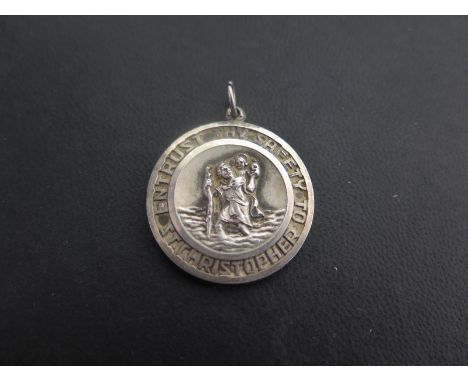 GEORG JENSEN  a St Christopher pendant - With boat, plane and car detail to the reverse - Hallmarked London, 1975 - Diameter 