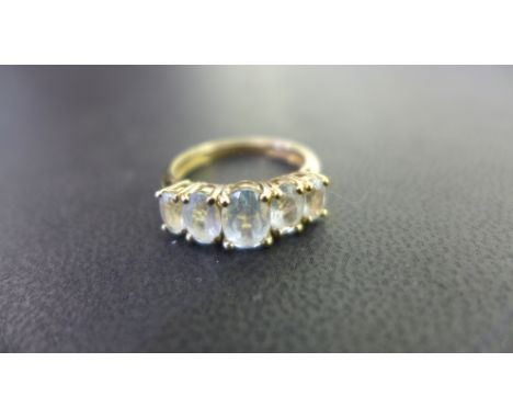A 9ct gold aquamarine five-stone ring - Hallmarked Birmingham - Ring size N - Weight approx 2.4gms
Condition Report: Good - W