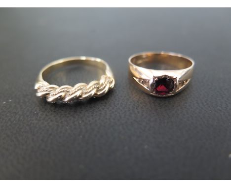 A garnet single-stone ring, size M - Together with a rope-twist dress ring, size Q 1/2 - Both with marks indicating 14ct gold