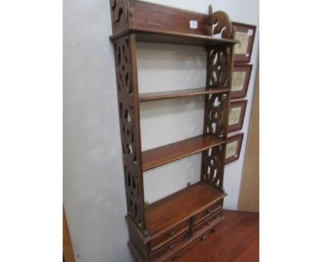 A nice four shelf narrow book case.