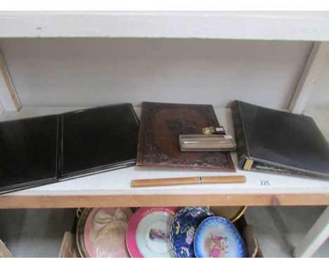 A shelf of vintage desk top items.