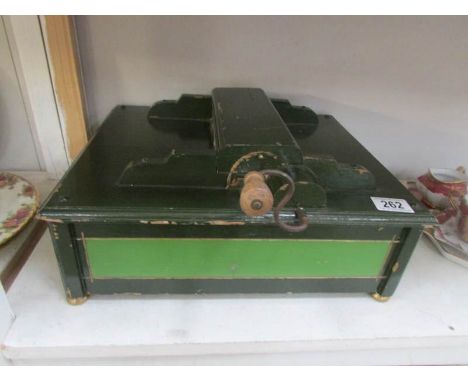An Organette roller organ, working but need music rolls.