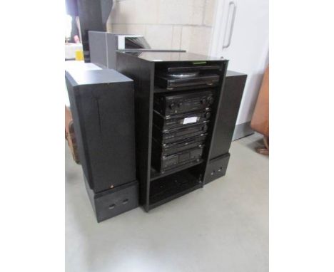 Kenwood stereo unit consisting of P-58 turntable, A-76 amplifier, T-78L tuner, GE-760 equalizer, DP-76 CD player and X-76 cas