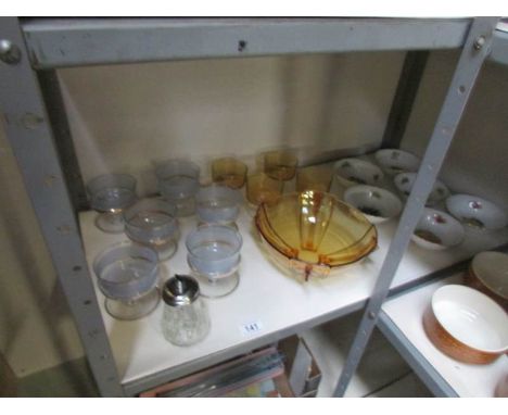 A shelf of glass and china fruit bowls etc.,