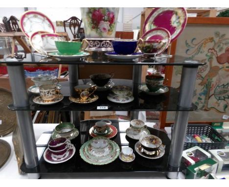 A collection of tea cups and saucers including Aynsley, Japanese etc.,