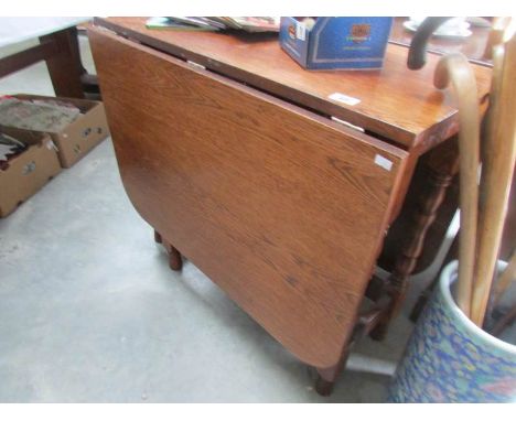 An oak gate leg table.