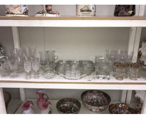 A shelf of glass ware.