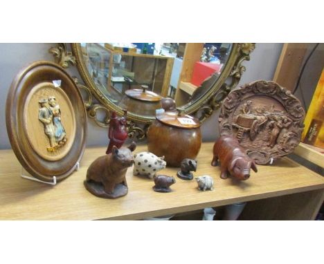 A shelf of miscellaneous including pigs, lidded pot etc.,